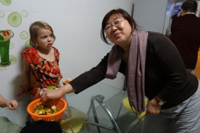 Dear Zhao, posing with a fruit salad that Piper made out of mandarin oranges, bananas, raisins and spicy dried peas, while I was talking on the phone and not paying attention.